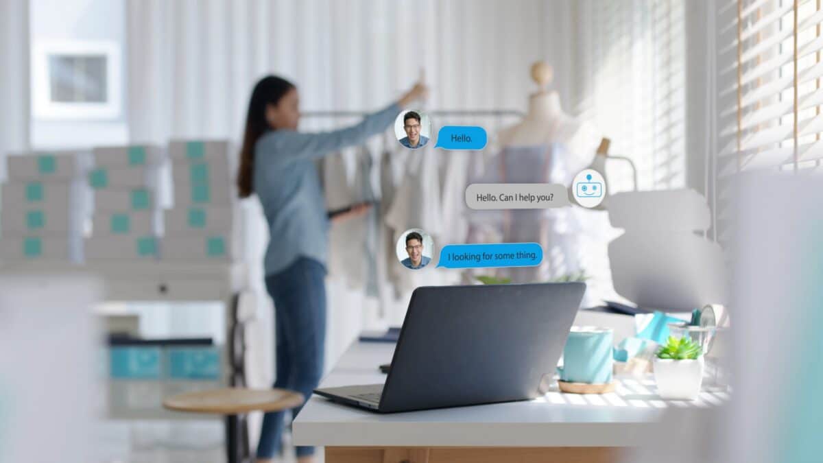 AI Chatbot on Computer Screen as person works in the background