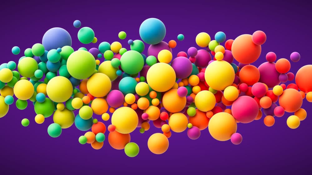 Colorful flying spheres background representing using color in marketing video for brand messaging