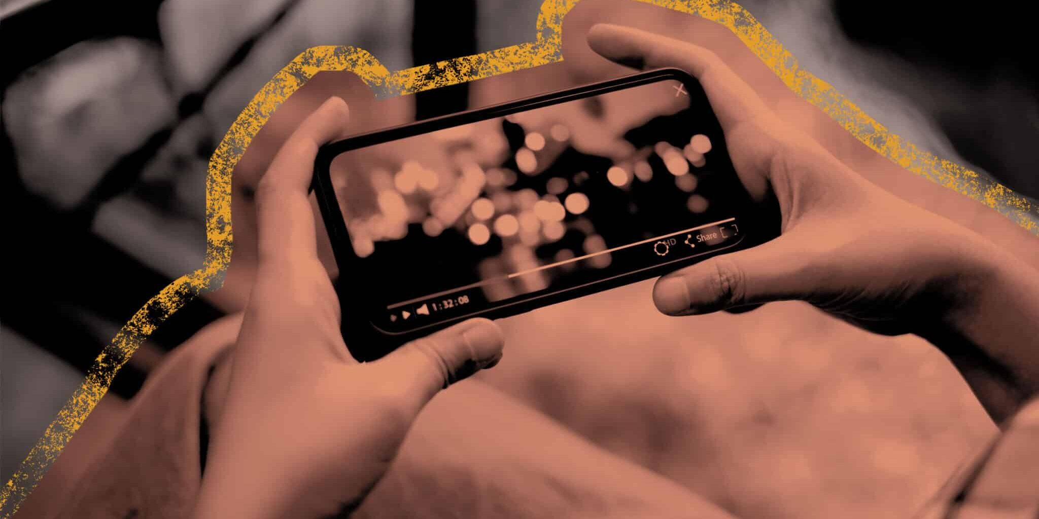 Person Watching the Best Video Ads Examples on a Smartphone